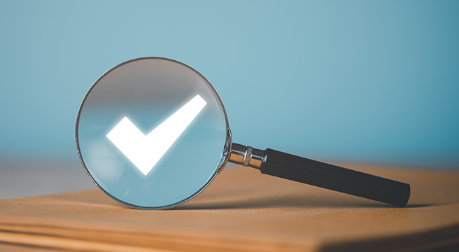 Image: Magnifying glass with check mark
